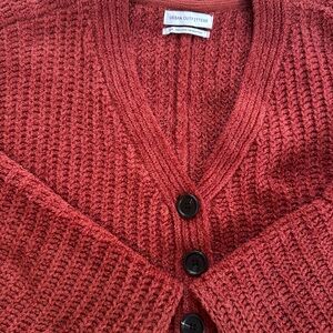 Rust-red Urban Outfitters cropped three-button sweater